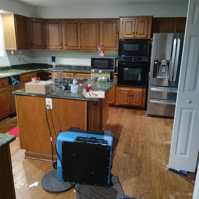 Drying unit on a hardwood floor by a kitchen island